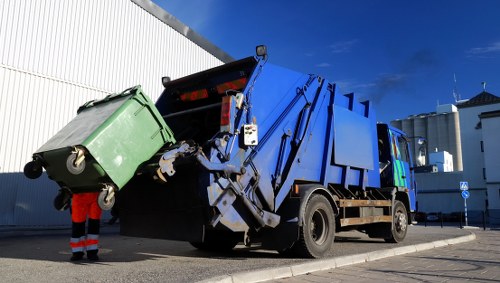 Wheelbarrow and bags of garden waste illustrating volume-based pricing