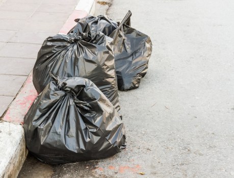 Recycling bins and separated materials at local transfer station